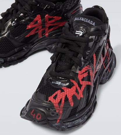 Balenciaga - Graffiti Runner Sneakers in black